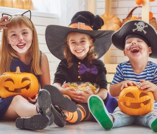children dressed up in halloween costumes